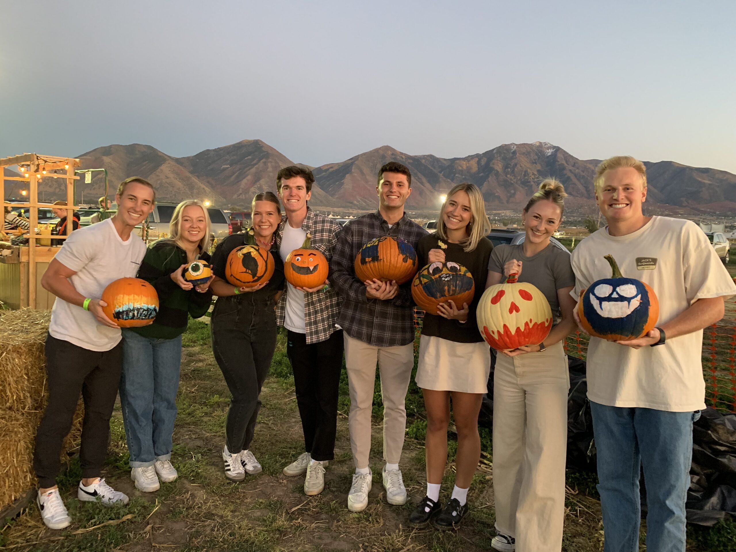 Friends enjoying a pumpkin decorating date night at Glen Ray’s Corn Maze