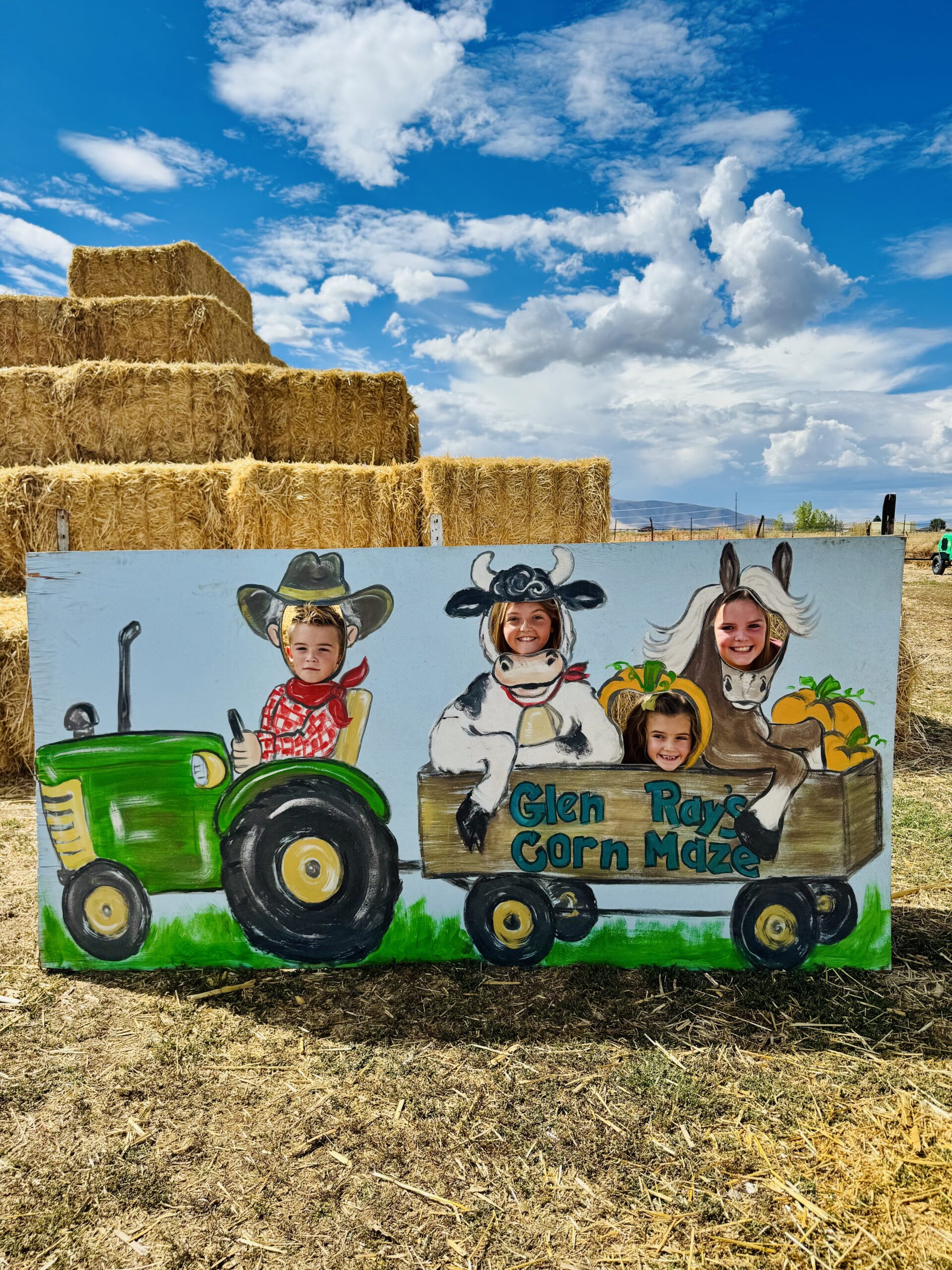 Children posing in the Glen Ray’s Corn Maze farm photo cutout